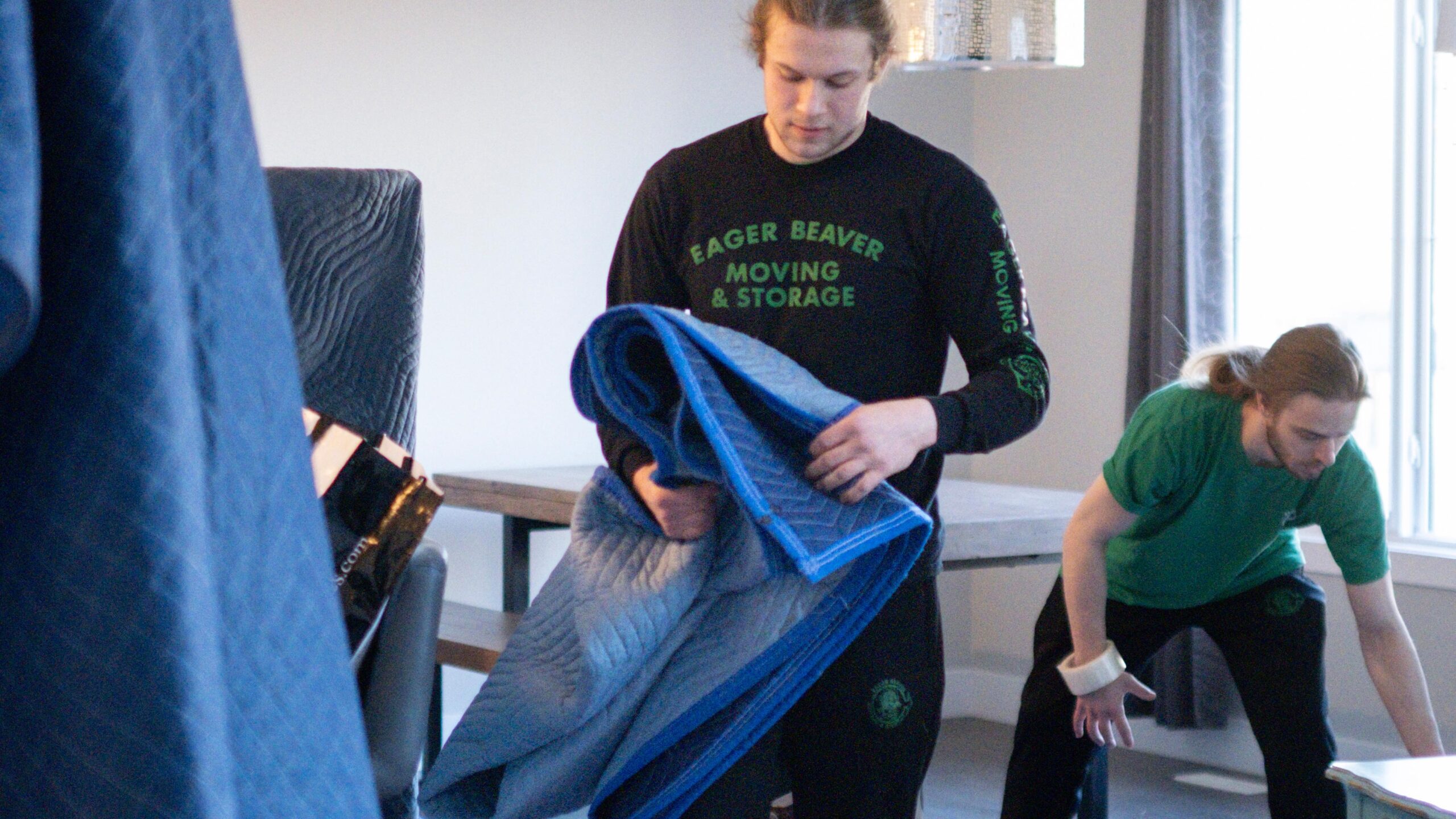 Professional packing of fragile belongings into moving boxes