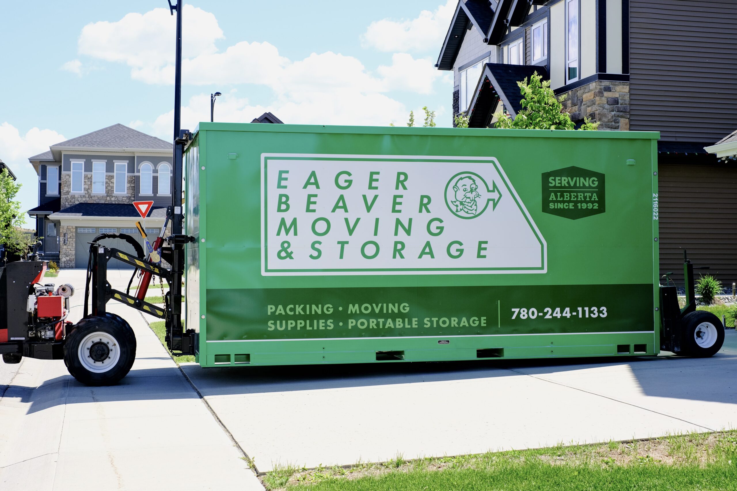 Portable storage container placed on a residential driveway